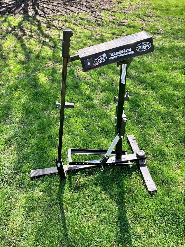 Louisville Slugger Black Flame Pitching Machine.